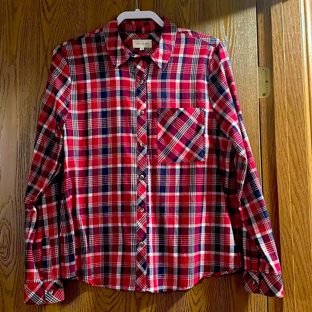 Women’s medium long sleeve shirt with 3/4 sleeve option.  Never worn.